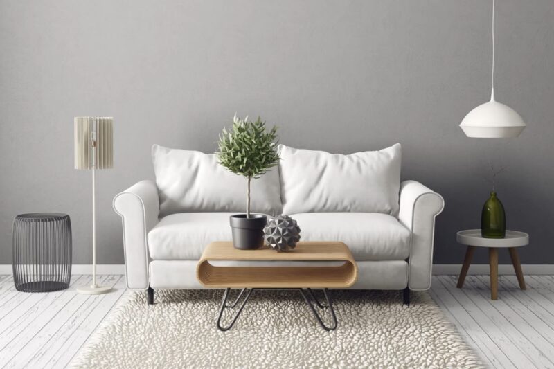 prikaz bele ugaone, lampe, tepiha, stolčića u dnevnom boravku